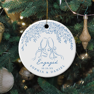 Blue Whimsical Cheers Our First Christmas Engaged Ceramic Ornament