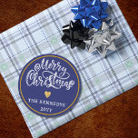 Blue White Gold Merry Christmas Classic Round Sticker<br><div class="desc">Make this holiday season extra special with our Blue White Gold Merry Christmas stickers. Whether you're embellishing your homemade gifts or sprucing up your holiday cards, these stickers are the perfect finishing touch. The sophisticated colour palette of black, white, and gold adds a touch of luxury to your Christmas festivities....</div>