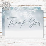 Blue Winter Snow Modern Wedding  Thank You Card<br><div class="desc">Embrace the magic of a winter wonderland with our enchanting wedding thank you card. Imagine a soft, dusty blue canvas reminiscent of a twilight sky, sprinkled with delicate white snowflakes as they gently fall. Ethereal bokeh lights shimmer above, evoking a sense of joyous celebration. A crisp white base, mimicking a...</div>