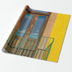 Blue wooden door on yellow concrete building wrapping paper