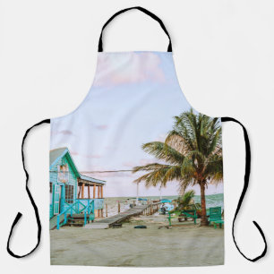 BLUE WOODEN HOUSE NEAR BODY OF WATER APRON