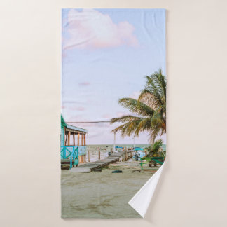 BLUE WOODEN HOUSE NEAR BODY OF WATER BATH TOWEL