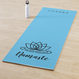 Blue yoga mat with lotus for teacher or instructor