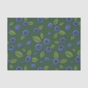 Blueberries on dark green tissue paper