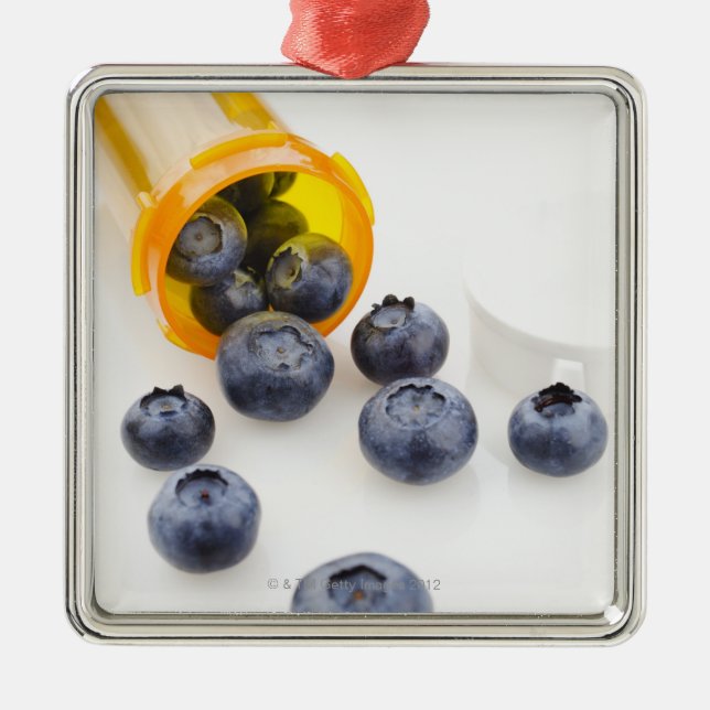 Blueberries spilling from prescription bottle metal tree decoration (Front)