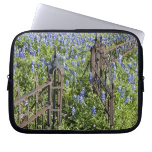 Bluebonnets and phlox surrounding cemetery gate laptop sleeve