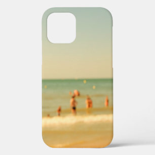 Blurred beach photo with bokeh. People relaxing on iPhone 12 Case