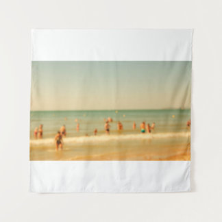 Blurred beach photo with bokeh. People relaxing on Tapestry
