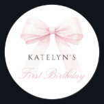 Blush Pink Bow First Birthday Classic Round Sticker<br><div class="desc">Celebrate your little one's special day with the Blush Pink Bow First Birthday Classic Round Sticker. This charming design sets the tone for a day filled with joy and wonder, blending modern style with timeless elegance. At its heart is a lovely blush pink bow, symbolising the gift of precious memories,...</div>