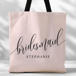 Blush Pink Bridesmaid Modern Script Tote Bag<br><div class="desc">Show your appreciation to your bridal party with this stylish blush pink bridesmaid tote bag. Featuring modern script and customisable with your bridesmaid's name, this tote bag is both practical and elegant. The soft colour and chic design make it perfect for carrying wedding day essentials or everyday items. This personalised...</div>