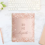 Blush rose gold glitter dust monogram name 2025 planner<br><div class="desc">A rose gold background with elegant blush faux glitter dust. Personalise and add a year (upside down) and add a name. The name is written in dark rose gold with a large modern hand lettered style script with swashes. Perfect for school, work or organising your personal/family life. To keep the...</div>