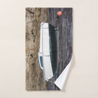Boat grounded at mooring in Brittany Hand Towel