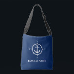 Boat Name Nautical Compass Anchor Navy Blue Crossbody Bag<br><div class="desc">Stylish navy blue crossbody tote bag with your personalised name,  boat name or other desired text. Features a custom designed nautical anchor and compass. Easily customise the base colour to match your current decor or theme. Great for vacation,  shopping and travelling. The perfect personalised gift for any occasion.</div>
