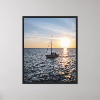 Boat Sailing into Sunset Stretched Canvas Print