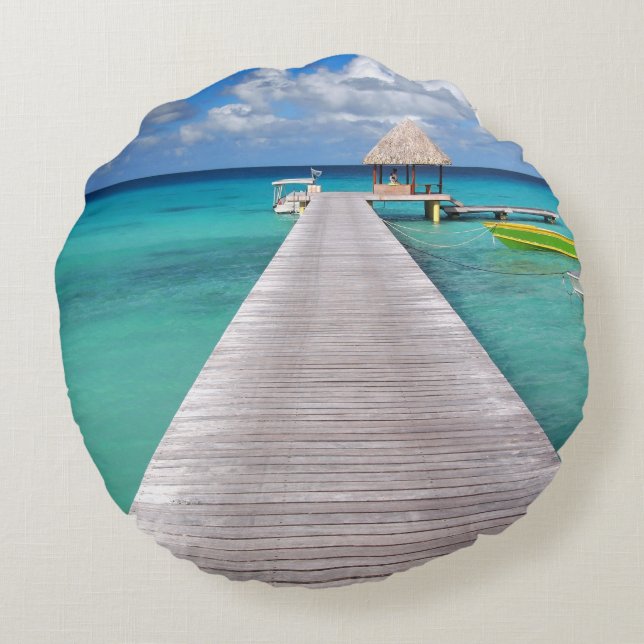 Boats at a jetty in the Pacific round throw pillow (Back)