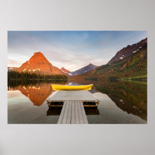 Boats on calm morning at Two Medicine Lake in Poster