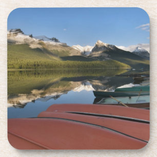 Boats parked on the lakeshore of Maligne Lake, Coaster