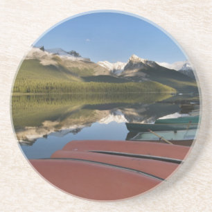 Boats parked on the lakeshore of Maligne Lake, Coaster