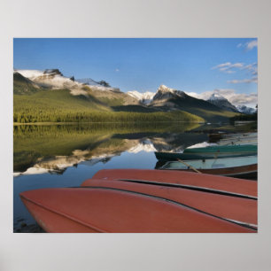 Boats parked on the lakeshore of Maligne Lake, Poster