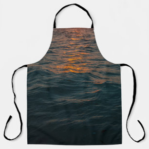 BODY OF WATER DURING SUNSET APRON