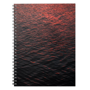 Body of water during sunset notebook