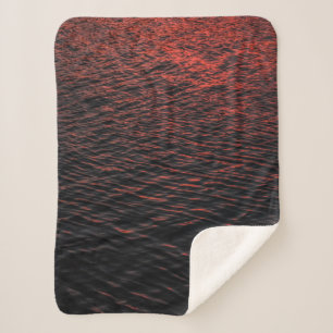 Body of water during sunset sherpa blanket