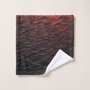 Body of water during sunset wash cloth