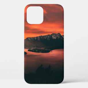BODY OF WATER NEAR MOUNTAINS AT GOLDEN HOUR iPhone 12 CASE