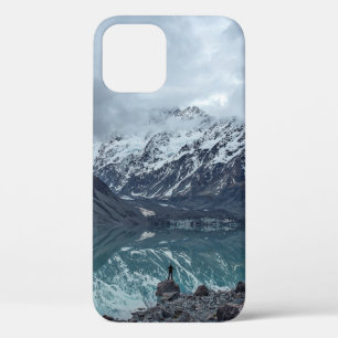 BODY OF WATER OVERLOOKING MOUNTAINS DURING DAYTIME iPhone 12 CASE