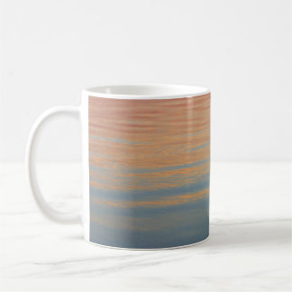 Body of water under golden hour coffee mug