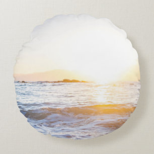Body of water under sunset round cushion