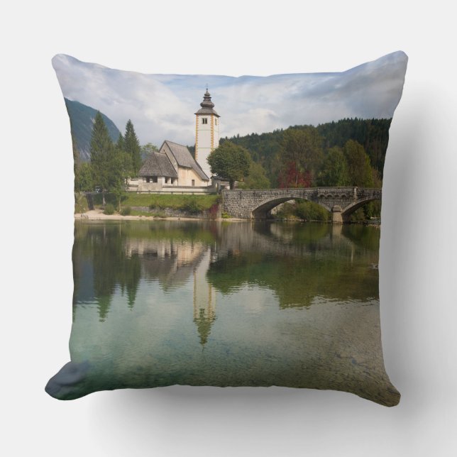 Bohinj lake with church in Slovenia throw pillow (Front)