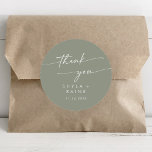 Boho Chic Sage Green Thank You Wedding Favour Classic Round Sticker<br><div class="desc">This boho chic sage green thank you wedding favour classic round sticker is perfect for a minimalist wedding. The neutral light green earth tone modern bohemian design features simple rustic calligraphy with a unique yet classic style.

Personalise your favour stickers with your names and wedding date.</div>