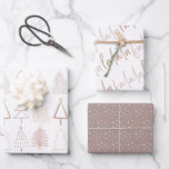 Boho Christmas Trees Falala Dusty Pink Holiday Wrapping Paper Sheet<br><div class="desc">This cute boho holiday wrapping paper features a set of 3 different designs of wrapping papers. 1. A light dusty pink background with christmas trees in shade of dusty pink. 2. A white background with falala in script lettering. 3. A light chestnut brown background with snow patterns. Change the background...</div>