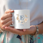 Boho Floral Monogram Mug with Editable Name<br><div class="desc">This boho-inspired floral monogram mug features a soft, rustic colour palette in beige, taupe, and dusty blue tones. Each cup showcases an elegant serif initial centred within a wildflower wreath, creating a personalised and timeless design. Below the letter, you can customise the name to make this mug a unique gift...</div>