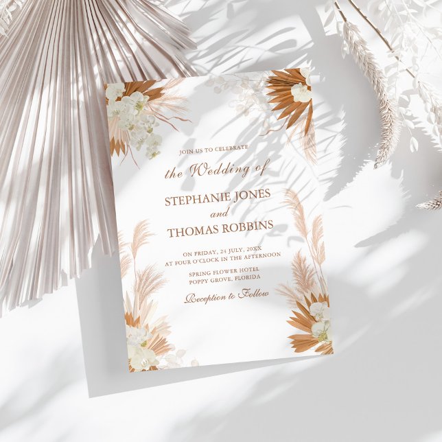 Boho Terracotta Pampas Grass Orchid Wedding Invitation (Boho Terracotta Pampas Grass Orchid Wedding Invitation on a sunny white table.)
