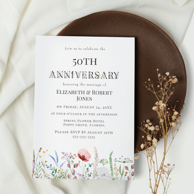 Boho Watercolor Wildflower Wedding Anniversary Invitation (Boho Wildflowers Anniversary Party Invitation on white table with dark brown plate)