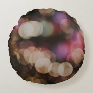 Bokeh photography of lights round cushion