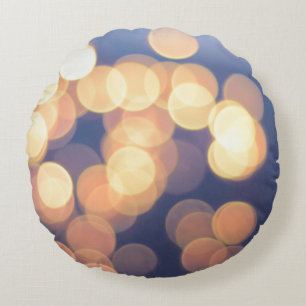 Bokeh photography of lights round cushion