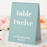 Bold Aqua Blue Retro Custom Wedding Number<br><div class="desc">Guide your guests effortlessly with this stylish wedding table number sign. Featuring a modern, minimalist design in a soft aqua blue with elegant white typography, this double-sided tented card is perfect for receptions, ensuring each table is easy to find. Personalise with names and wedding date for a seamless and coordinated...</div>