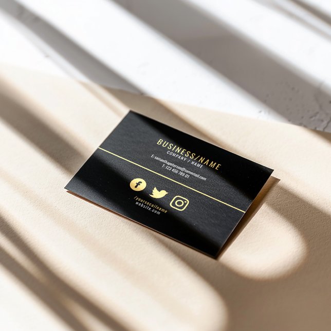 Bold black and gold social media luxury business card (Modern simple black business card with gold text, minimalist layout, and social media icons.)