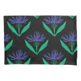 Bold blue cornflower on black pillowcase