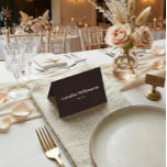 Bold Brown Typography Custom Wedding Place Card<br><div class="desc">This folded place card in brown and cream features a deep, modern background paired with clean serif typography for a refined table setting. The minimalist layout clearly displays each guest’s name and table number, making it easy for guests to find their seat at a glance. Personalise the text to coordinate...</div>