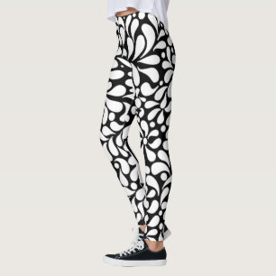 Bold modern white flowers on black background leggings
