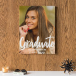 Bold Script Graduate Photo Custom 2024 Graduation Faux Canvas Print<br><div class="desc">Graduate is written in bold white handwritten script over your senior portrait photo makes a chic,  modern graduation canvas art. Customise this print with your high school or university class year 2024 under the bold typography and add a cute photograph of your senior.</div>