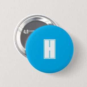 Bold white initial bright blue 6 cm round badge