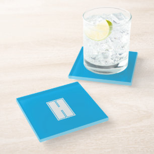 Bold white initial bright blue glass coaster