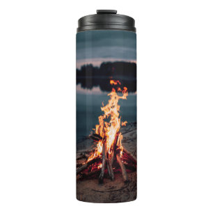 Bonfire near body of water during night time thermal tumbler