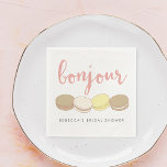 Bonjour French Macarons Bridal Shower Napkin<br><div class="desc">Bonjour! Add a touch of Parisian style to your bridal shower with these pretty cocktail napkins. Design features four delicious French macaron illustrations in pastel pink, ivory, tan and pale yellow, with "Bonjour" in peachy pink handwritten style script lettering. Customize with the guest of honor's name for a personalized touch....</div>