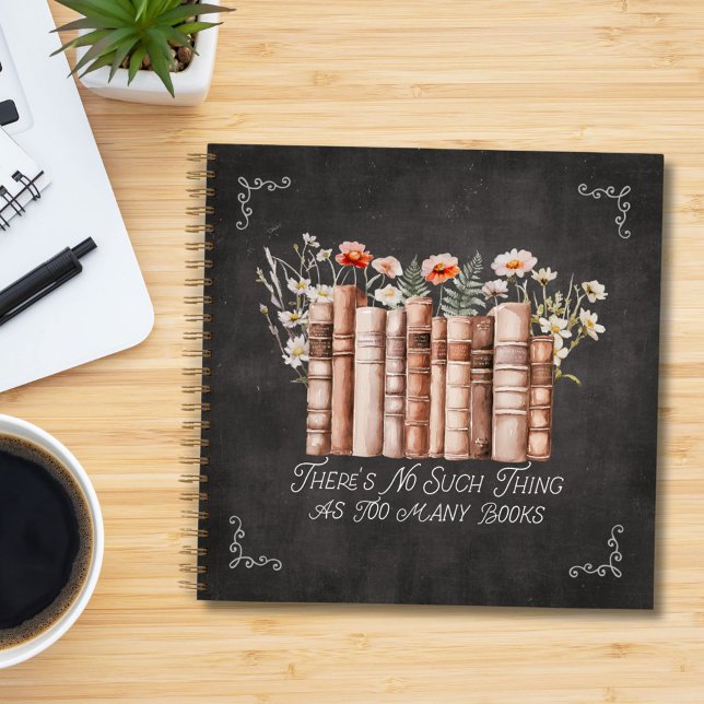 Books with Flowers and Quote on Black Notebook (in situ)